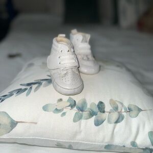 Soft white infant shoes